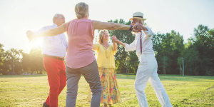Group of seniors dancing at the park